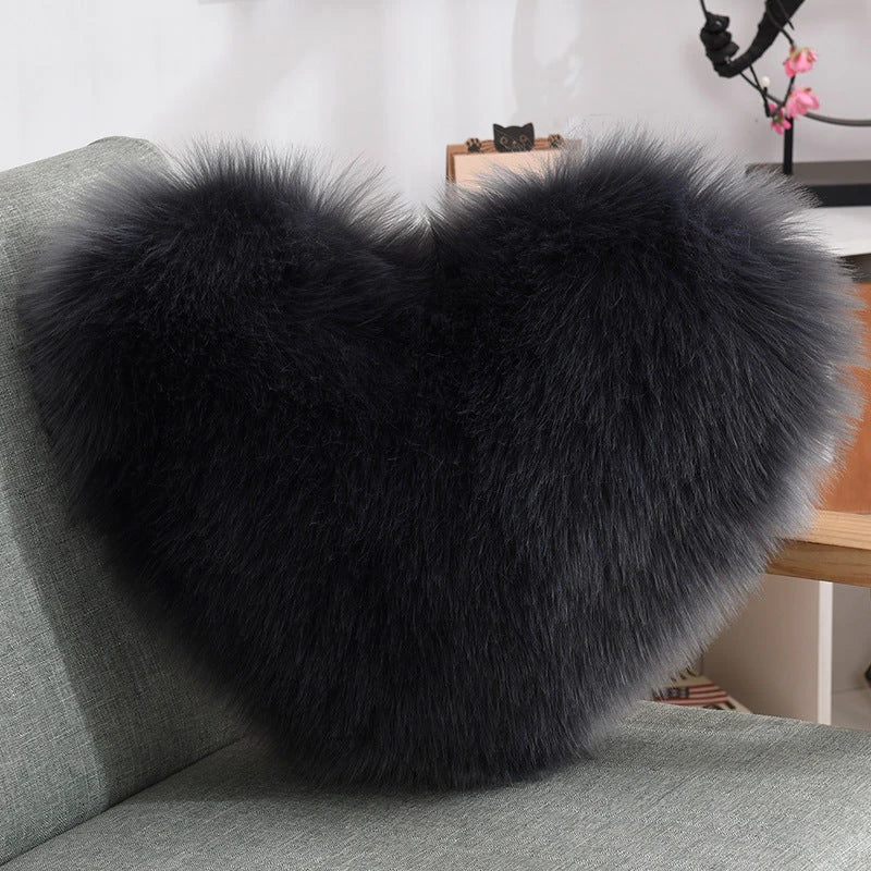 Plush heart-shaped throw pillows in various colors and styles for cozy sofa decor