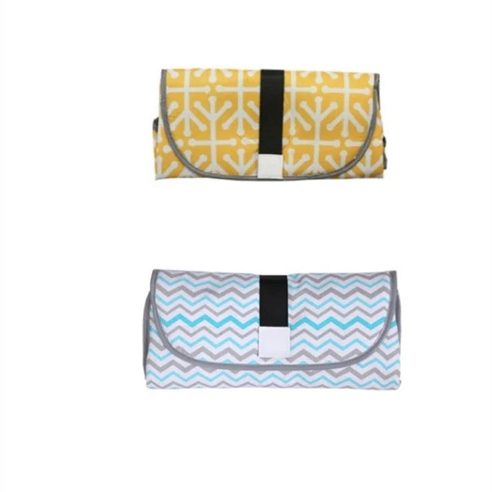 Waterproof portable baby changing pad in various colors, perfect for on-the-go nappy changes