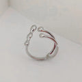 Gold and silver brass women's fashion ring with spherical design detail.