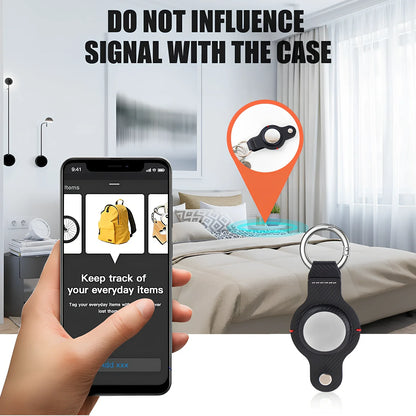 Black PU leather AirTag holder keychain with metal ring, 4cm diameter, secure snap fit for tracking valuables