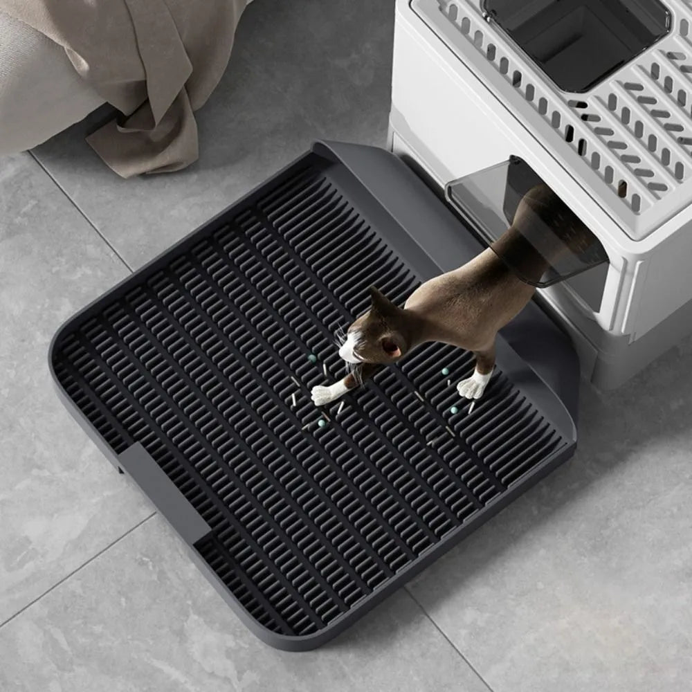 Large black cat litter pedal mat with slanted mouth design and textured surface
