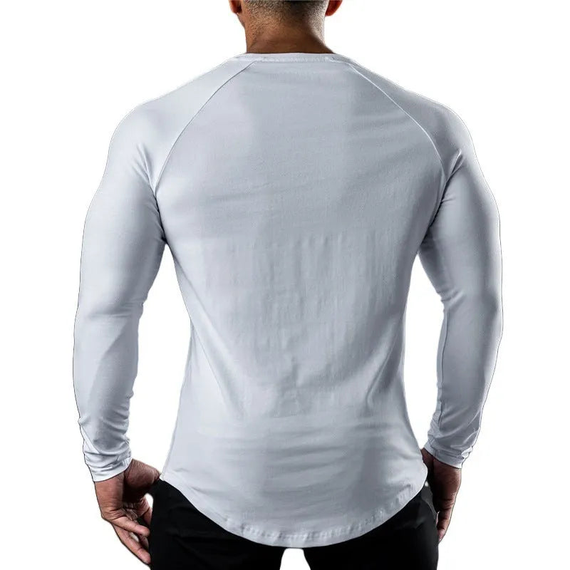 Men's long sleeve cotton sports t-shirt in tight fit with round neck, available in multiple colours