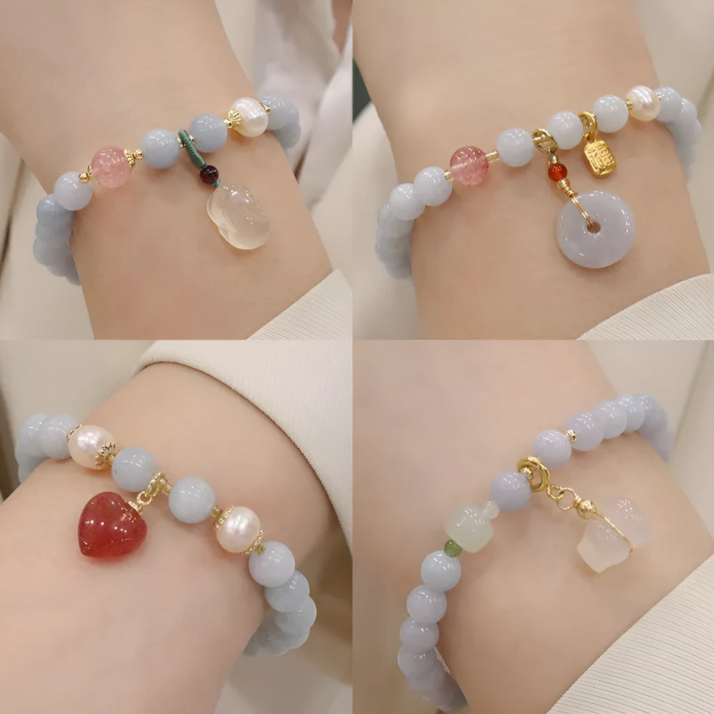 Gold plated women's bracelet with aquamarine chalcedony crystal pendant and floral design.
