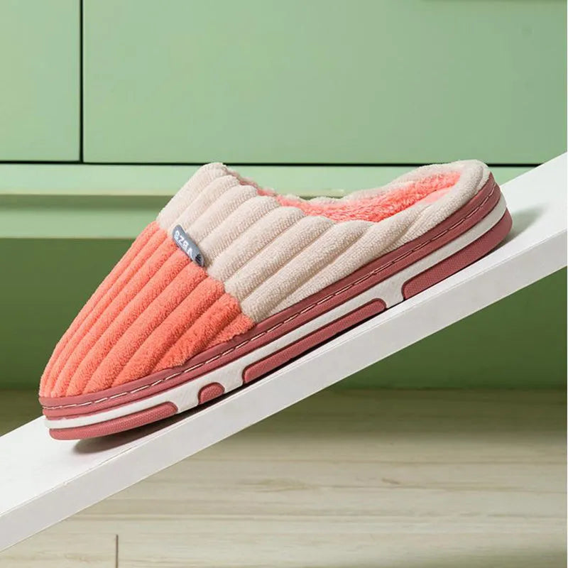 Unisex winter slippers in candy colour, suede upper, TPR sole, Baotou style, on a clean background.