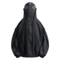 Black loose-fit padded cotton cardigan with a zip front and hood on a model.