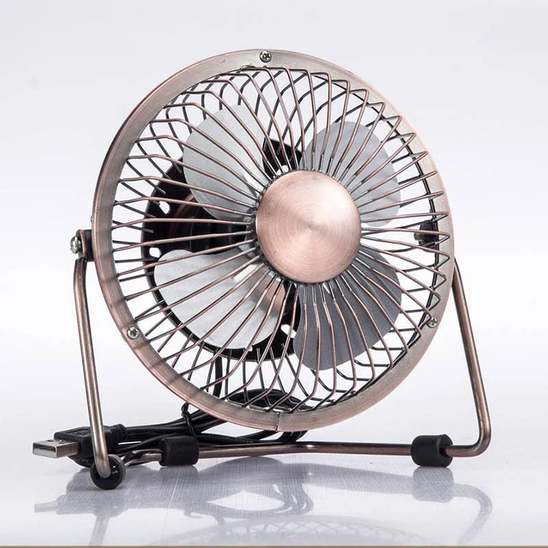 4-inch metal USB mini fan in bronze colour with rocker switch on desk