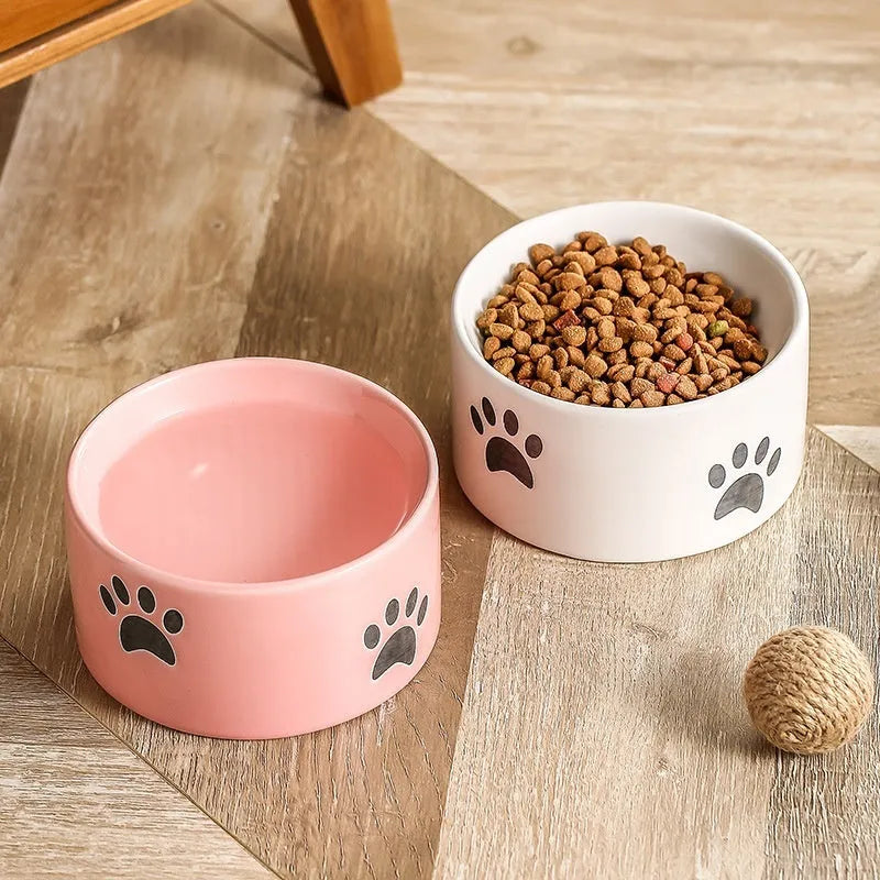 Ceramic cat bowl with slanted mouth design showing cat's paw pattern in yellow colour