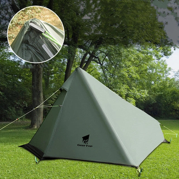 Green poleless camping tent with right opening showing interior 220cm length and 115cm height