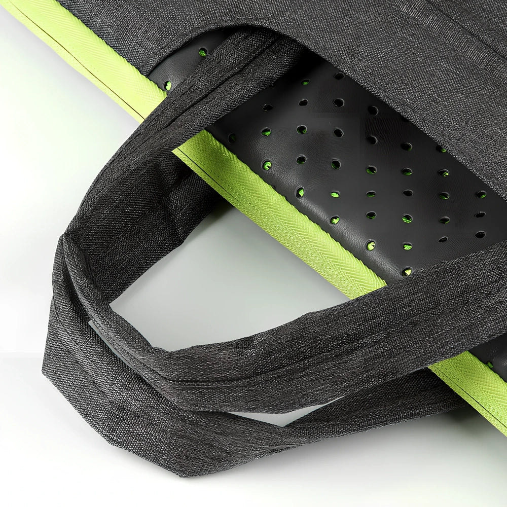 Grey laptop sleeve for MacBook with ant cloth exterior and soft handle, showing internal plush lining