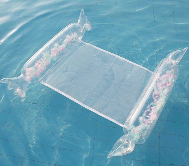 Inflatable water lounge chair in blue, floating in pool with hammock design visible