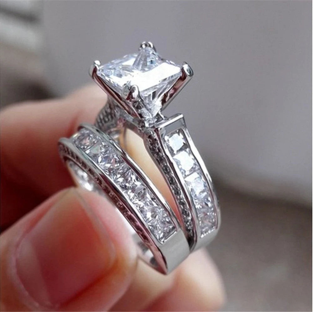 Silver charm couple rings with princess cut CZ, perfect for anniversaries, promises, or engagements