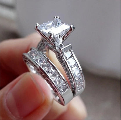 Silver charm couple rings with princess cut CZ, perfect for anniversaries, promises, or engagements
