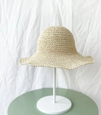 Women's foldable straw sun hat with wide brim for summer sun protection