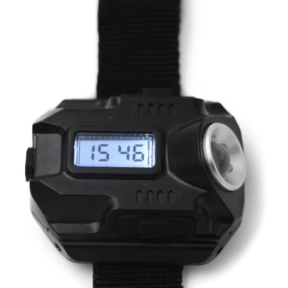 Black LED watch flashlight with time display and compass on wristband for outdoor use