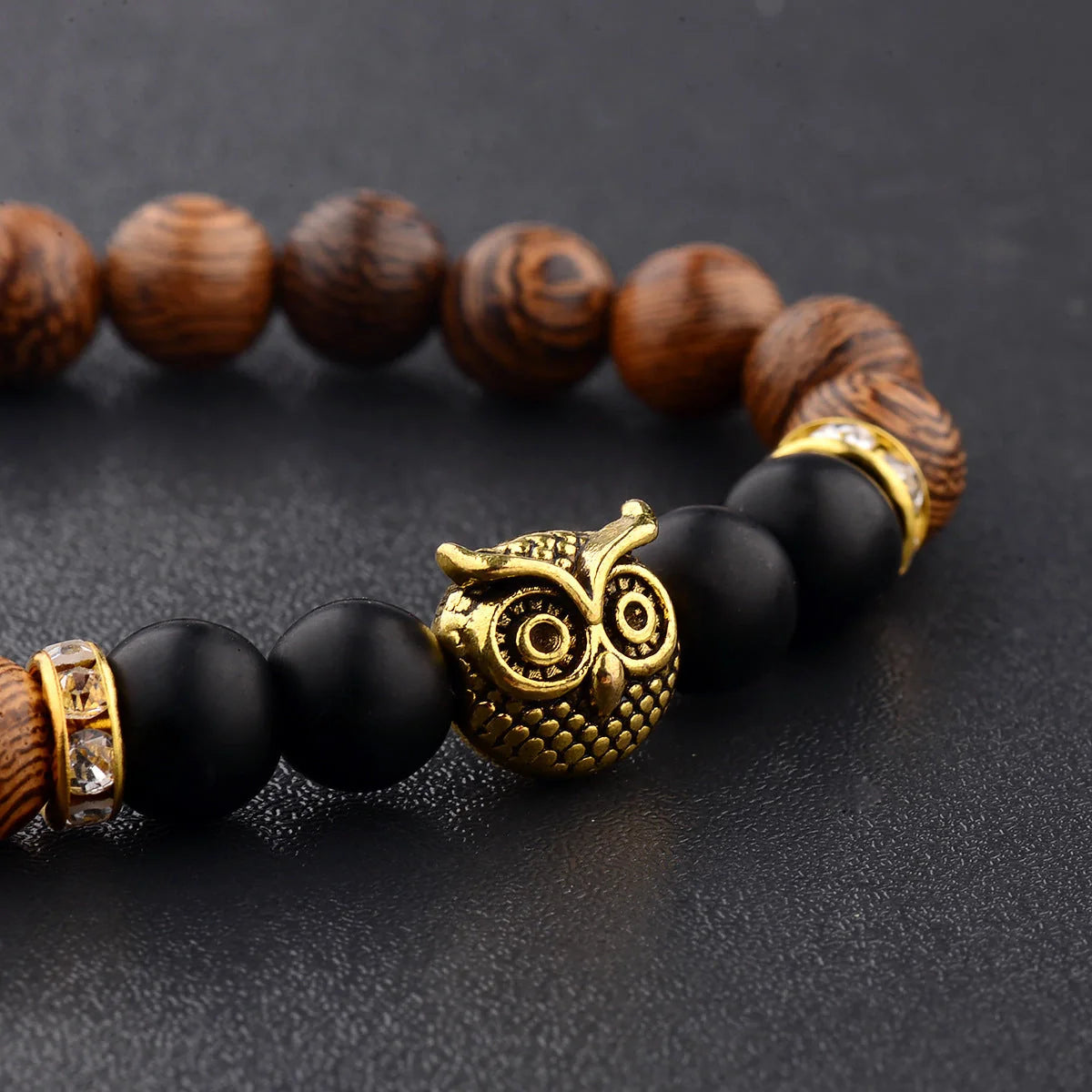 Owl frosted stone lifeline wood grain bracelet in black and gold, adjustable for a perfect fit