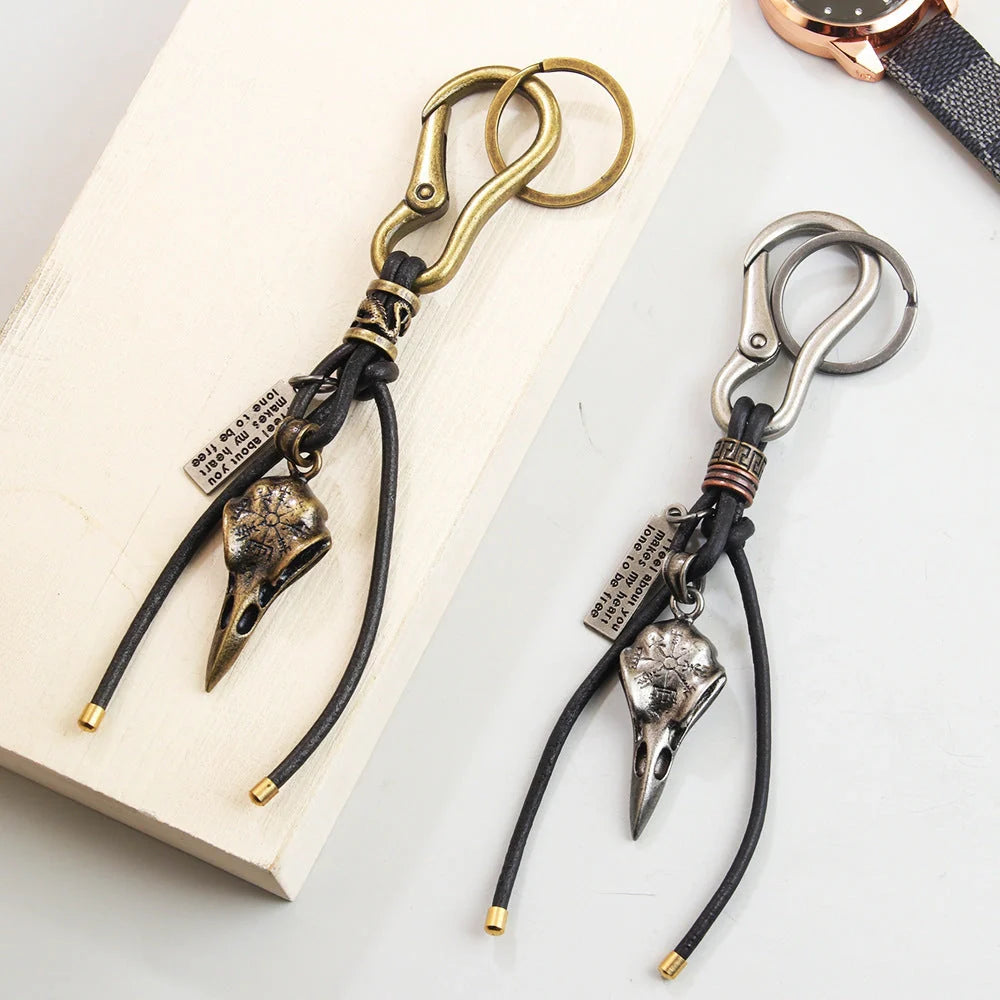 Retro leather rope keychain with lobster buckle and skull pendant in bronze and silver