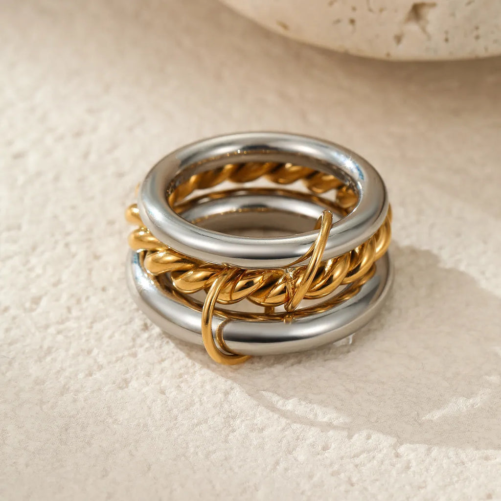 Stacked colour matching stainless steel rings with 18K gold plating in free size format