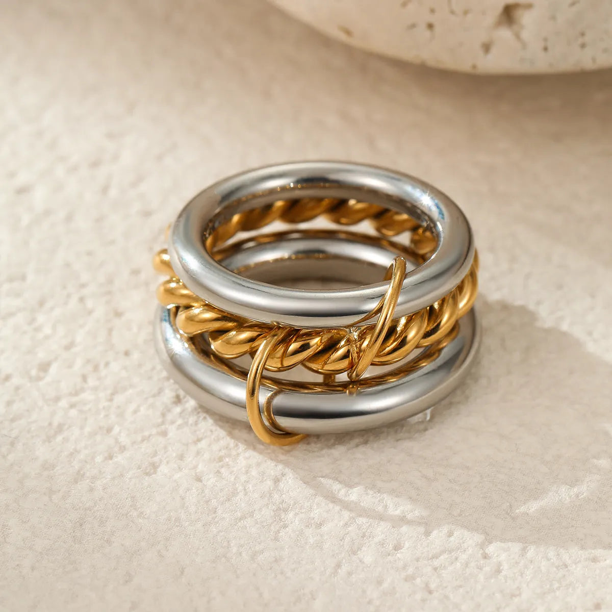 Stacked colour matching stainless steel rings with 18K gold plating in free size format