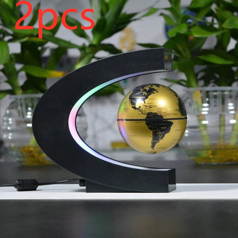 Magnetic levitation globe floating above base with LED light on