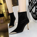 Women's suede stiletto heel ankle boots in black with pointed toe and metal detail