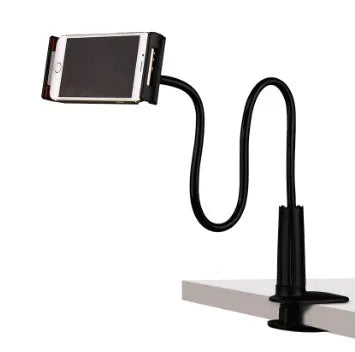 Black oversize flat panel phone stand with a long adjustable arm on a wooden table.