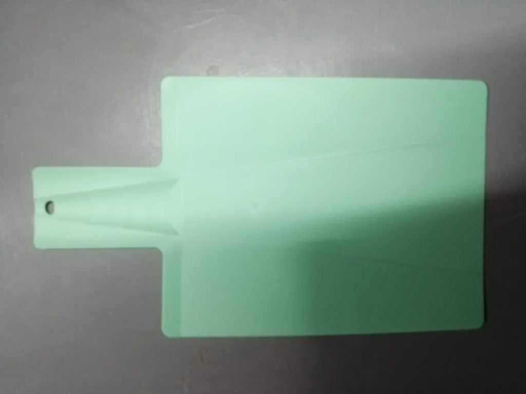 Green folding plastic cutting board 37.5cm x 21cm with non-slip texture and hanging hole on a kitchen counter