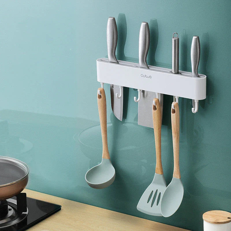 Wall-mounted knife holder in grey and black, holding 4 knives and 6 utensils