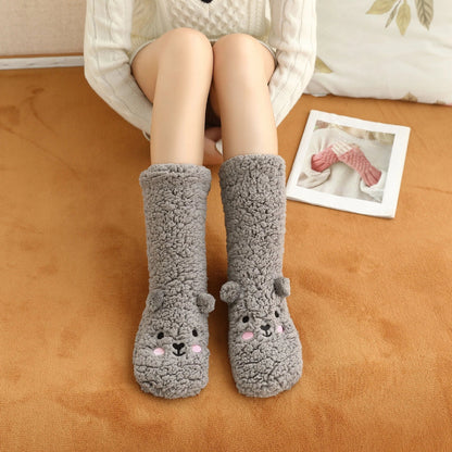 Cozy coral fleece socks in various colors, featuring a plush, insulating texture and non-slip grippy sole for comfortable home wear.