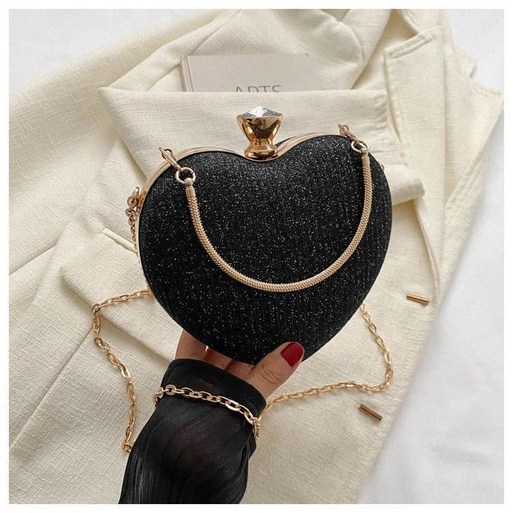 Heart-shaped shiny metal clutch bag with chain strap in various colours