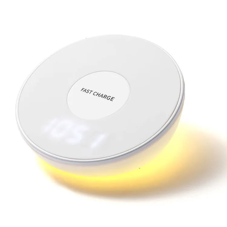 White wireless phone charger with LED digital clock display and three control buttons on the front.