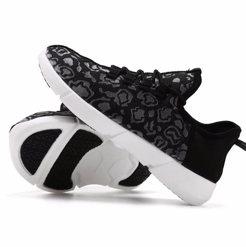 Casual loafers for men and women with fly woven upper, flat heel, and luminous accents in white colour option