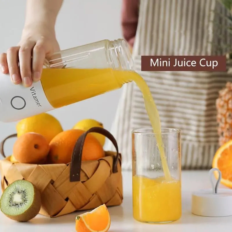 White portable USB rechargeable blender bottle with silicone handle and stainless steel blade.