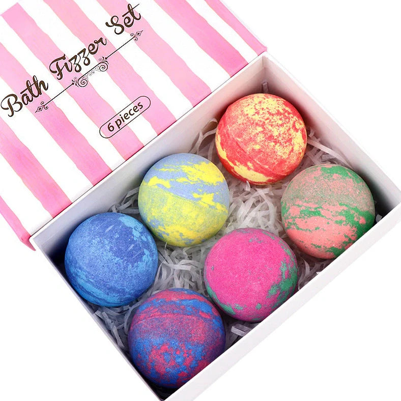 Six spherical 4cm diameter bath salt balls in mixed colours with 60g weight each containing shea butter and essential oils