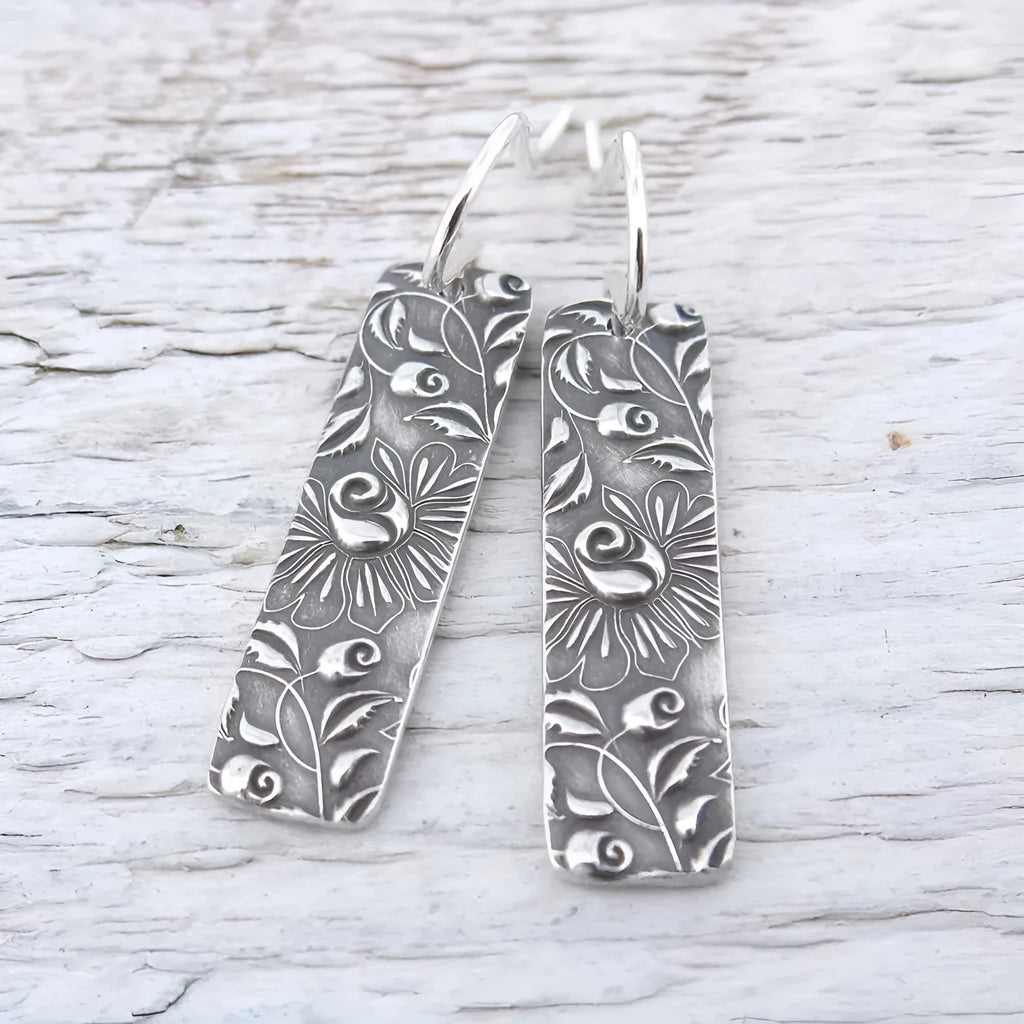 Silver geometric long drop earrings with carved vine patterns and retro design