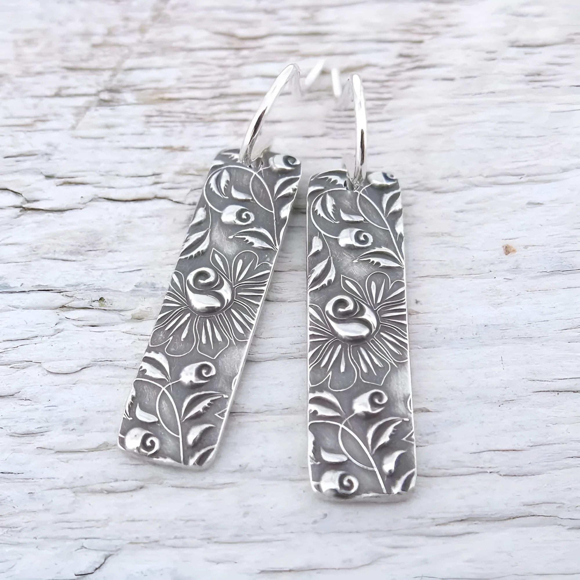 Silver geometric long drop earrings with carved vine patterns and retro design