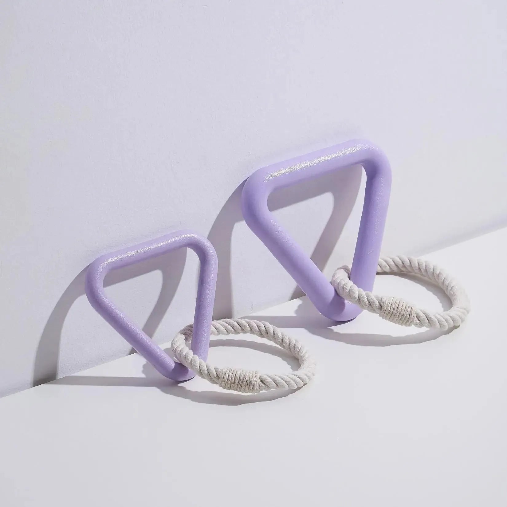 Large triangular braided cotton rope dog pull ring toy in beige, pink, or purple.