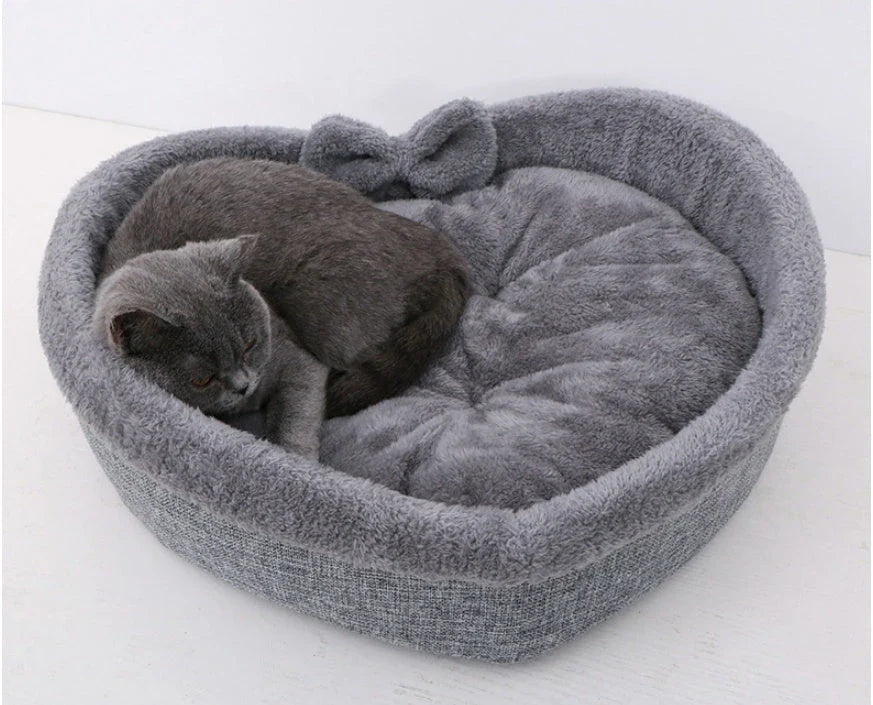 Cozy heart-shaped pet bed in grey and pink colors, designed for small, medium, and large dogs and cats