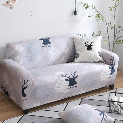 Printed stretchable sofa slipcover covering a three-seater sofa in a modern geometric pattern