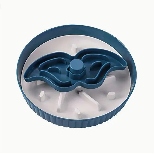 Rotating plastic pet food bowl with a blue silicone slow feed licking mat insert in a windmill pattern.