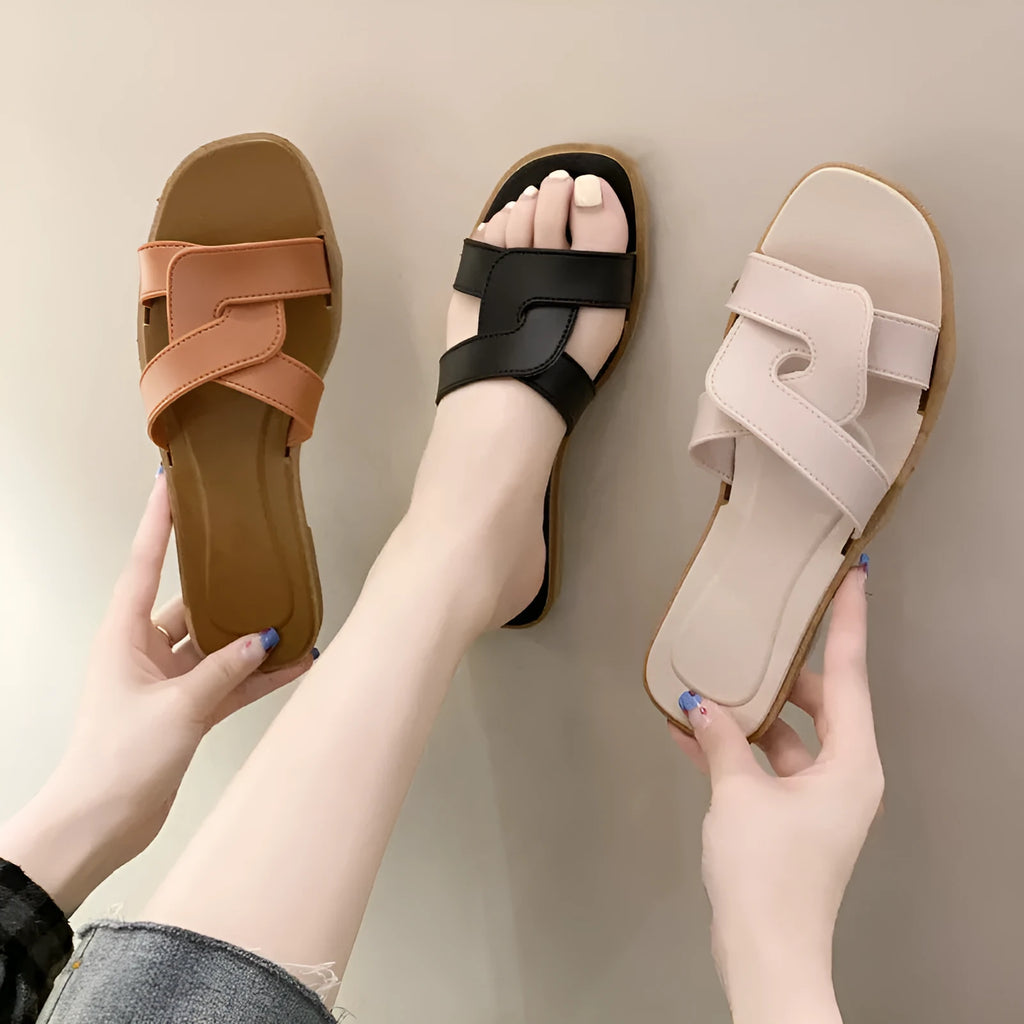 Women's PVC cross-strap flip-flop sandals in milky white, shown for home casual wear.