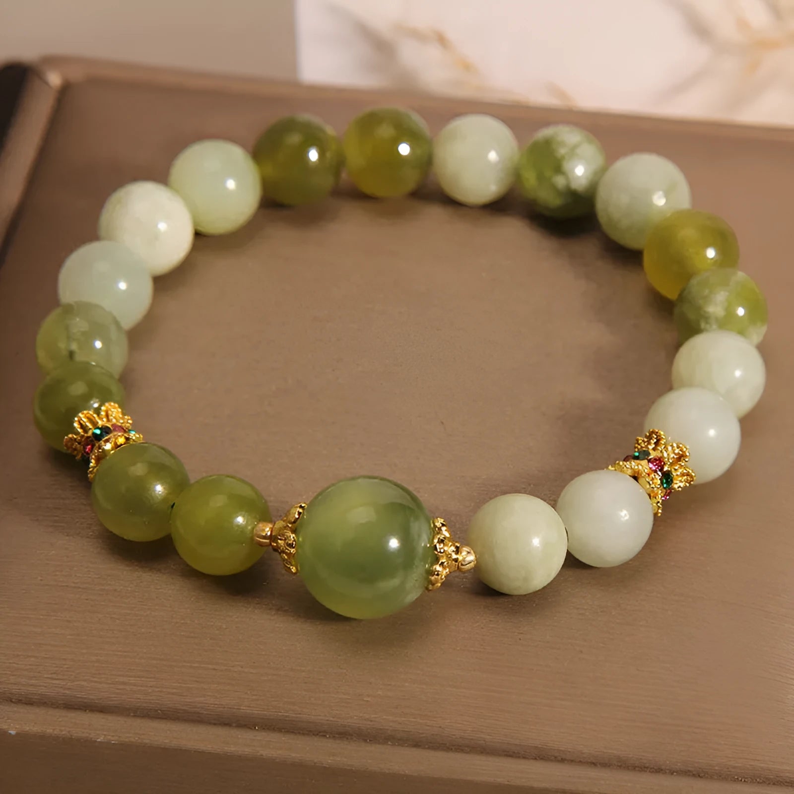 Original design women's bracelet with a green Xiuyan jade stone centrepiece.