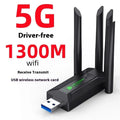 Black USB network transmitter with four extended antennas for computer wireless connectivity