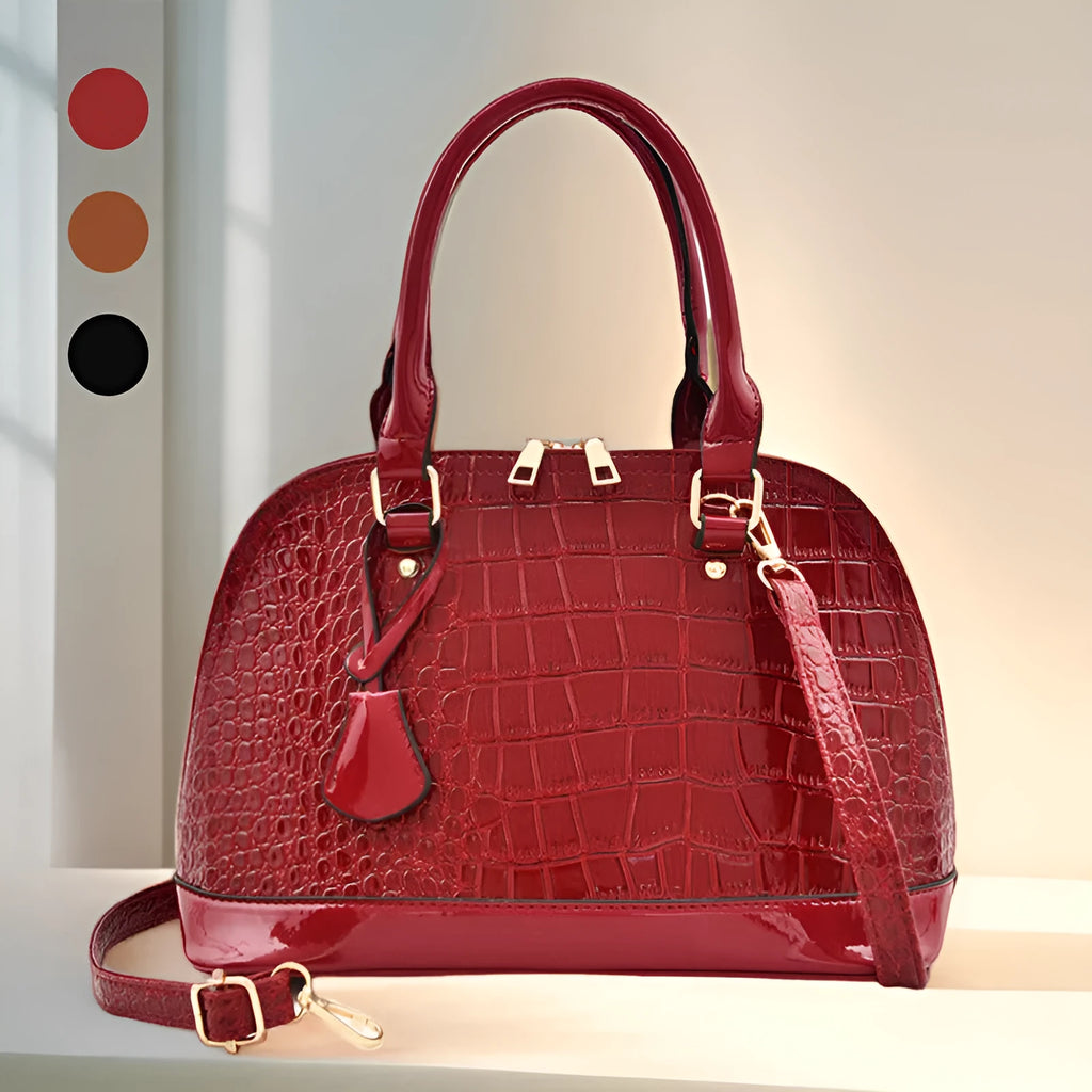 Shiny black PU crossbody shoulder bag with a structured shell shape.