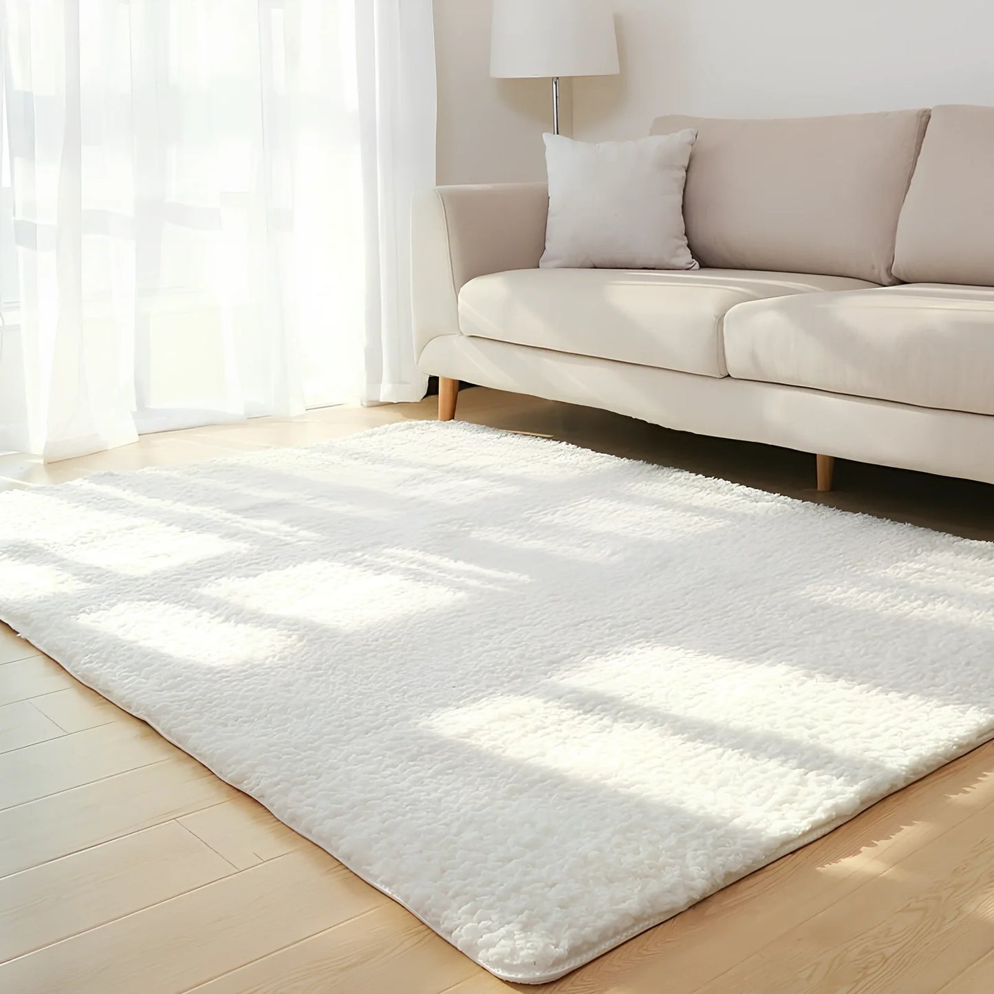 White plush solid rectangle area rug with non-slip dotted base, 100x160cm size, three-layer velvet and sponge construction for home floors