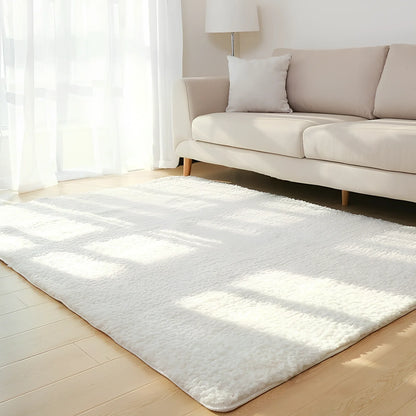 White plush solid rectangle area rug with non-slip dotted base, 100x160cm size, three-layer velvet and sponge construction for home floors