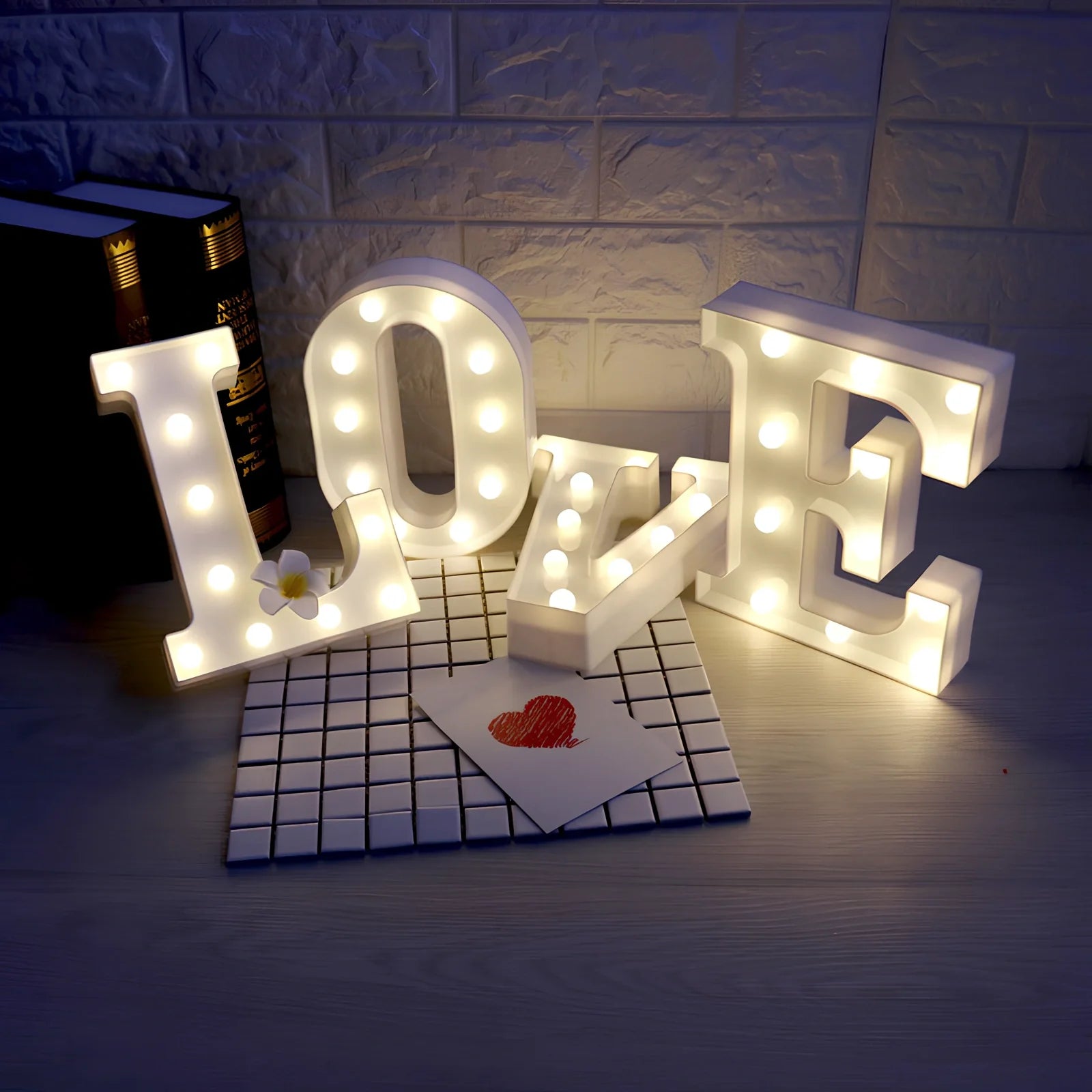 White plastic LED alphabet marquee sign with warm white illumination, 22cm height with battery operation