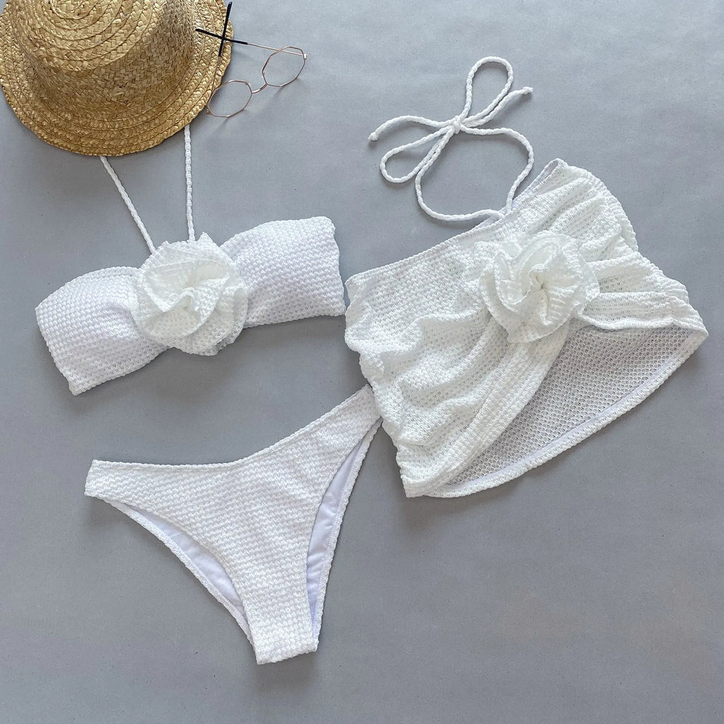 Women's white three-piece bikini set with 3D flower split detail on the briefs