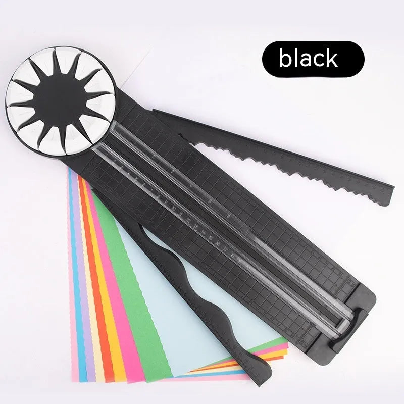 Pink and black 12-in-1 plastic dotted paper cutter on a white background.