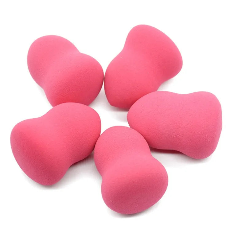 Pink rectangular makeup foundation sponge for wet or dry application measuring 4cm by 4cm by 5.6cm