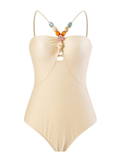 Women's one-piece swimsuit with hollow gem sling design in sapphire blue colour